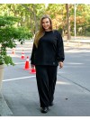 Жіночий прогулянковий костюм з теплого трикотажу чорного кольору 35573