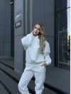 Жіночий теплий костюм з капюшоном молочного кольору 34513