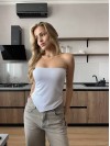 Жіночий топ з асиметричним краєм молочного кольору 33990